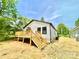 Exterior shot of the house featuring a deck with wood stairs at 253 Hall Nw Ave, Concord, NC 28027