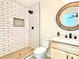 Modern bathroom featuring tiled shower with niche and modern vanity at 253 Hall Nw Ave, Concord, NC 28027