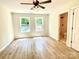 Light-filled bedroom with new flooring and two windows and attached bath at 253 Hall Nw Ave, Concord, NC 28027