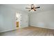Bedroom with wood-look flooring and view to ensuite bathroom at 253 Hall Nw Ave, Concord, NC 28027