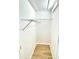 Walk-in closet with wire shelving and wood floor at 253 Hall Nw Ave, Concord, NC 28027