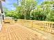 Spacious wooden deck showcases the beauty and craftsmanship of the home's construction, offering a relaxing outdoor space at 253 Hall Nw Ave, Concord, NC 28027