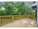 Spacious wooden deck with natural finish and wood railing, perfect for outdoor entertaining and relaxation at 253 Hall Nw Ave, Concord, NC 28027