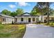 Charming renovated bungalow featuring a welcoming front porch and a well-manicured lawn at 253 Hall Nw Ave, Concord, NC 28027