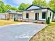 Charming newly renovated home featuring a covered front porch and fresh landscaping at 253 Hall Nw Ave, Concord, NC 28027