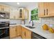 Bright kitchen with stainless appliances, tile backsplash and wood cabinets at 253 Hall Nw Ave, Concord, NC 28027