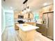 Modern kitchen featuring stainless steel appliances, quartz countertops, and a center island at 253 Hall Nw Ave, Concord, NC 28027