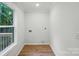 Laundry room with hardwood floors and a window at 253 Hall Nw Ave, Concord, NC 28027
