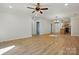Spacious living room with sleek ceiling fan and hardwood floors at 253 Hall Nw Ave, Concord, NC 28027