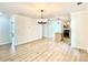 Bright and airy living room and kitchen with light wood floors, perfect for entertaining at 253 Hall Nw Ave, Concord, NC 28027