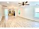 Bright and airy living room and kitchen with light wood floors, perfect for entertaining at 253 Hall Nw Ave, Concord, NC 28027