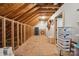 Unfinished attic space with exposed beams, boxes, and additional storage potential at 270 North St, Salisbury, NC 28147