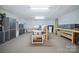 Spacious basement with carpet, cabinets, and work benches, perfect for hobbies and storage at 270 North St, Salisbury, NC 28147