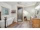 Elegant bathroom featuring a freestanding tub, walk-in shower, and vanity area at 270 North St, Salisbury, NC 28147