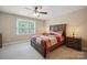 Bedroom with neutral walls, a ceiling fan, carpet and a window at 270 North St, Salisbury, NC 28147