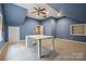 Bonus room with blue walls, a ceiling fan, carpet and good natural light at 270 North St, Salisbury, NC 28147
