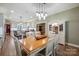Dining area adjacent to kitchen offers a view to the kitchen island and access to the home's entry at 270 North St, Salisbury, NC 28147