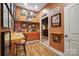 Theater-themed game room with a snack bar and a view into the home movie theater at 270 North St, Salisbury, NC 28147