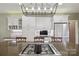 Modern kitchen island with gas range with a view to the counter space and stainless fridge at 270 North St, Salisbury, NC 28147