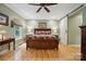 Spacious bedroom featuring a wooden bed, hardwood floors, and a sliding barn door at 270 North St, Salisbury, NC 28147