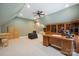 Spacious office featuring a ceiling fan, carpet, custom cabinets and a desk at 270 North St, Salisbury, NC 28147