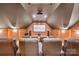 Home theater boasts tiered seating, projector, surround sound speakers, and a large screen at 270 North St, Salisbury, NC 28147