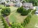 Expansive backyard featuring lush lawn, mature trees, and manicured landscaping, perfect for outdoor enjoyment and activities at 2812 Julian Glen Cir, Waxhaw, NC 28173
