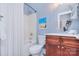 Full bath with a shower and tub combination, wooden vanity, and an oval mirror at 2812 Julian Glen Cir, Waxhaw, NC 28173