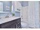 Bright bathroom featuring modern vanity with marble countertop and shower-tub combo at 2812 Julian Glen Cir, Waxhaw, NC 28173