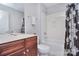 Bathroom with a wooden vanity, neutral walls, and a shower and tub combo at 2812 Julian Glen Cir, Waxhaw, NC 28173