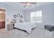 Bright bedroom with a comfy bed, decorative pillows, and a cozy upholstered ottoman at 2812 Julian Glen Cir, Waxhaw, NC 28173
