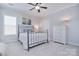 Comfortable bedroom featuring an iron bed frame, a large window, and a dresser at 2812 Julian Glen Cir, Waxhaw, NC 28173