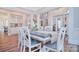 Open-concept dining room with chandelier and views to stairway and living room at 2812 Julian Glen Cir, Waxhaw, NC 28173