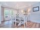 Elegant dining area with a chandelier and a neutral color scheme at 2812 Julian Glen Cir, Waxhaw, NC 28173