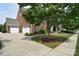 A brick house with a three-car garage and well-maintained landscaping at 2812 Julian Glen Cir, Waxhaw, NC 28173