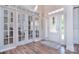 Bright foyer with hardwood flooring, French doors, and natural light at 2812 Julian Glen Cir, Waxhaw, NC 28173
