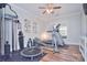 Home gym with workout equipment, light gray walls, and hardwood floors for a perfect exercise space at 2812 Julian Glen Cir, Waxhaw, NC 28173
