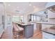 Eat-in kitchen featuring an island with seating, granite countertops, stainless steel appliances, and an open layout at 2812 Julian Glen Cir, Waxhaw, NC 28173