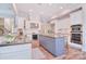 Beautiful kitchen with stainless steel appliances, granite countertops, gray island, and ample cabinet space at 2812 Julian Glen Cir, Waxhaw, NC 28173