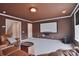 Living room with brown walls, plush carpet, and a movie screen at 2812 Julian Glen Cir, Waxhaw, NC 28173