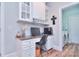 Dedicated home office with built-in cabinets, granite countertop desk, and convenient access to laundry room at 2812 Julian Glen Cir, Waxhaw, NC 28173