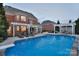 Inviting backyard pool featuring a diving board and a nice seating area, perfect for entertaining Gathering and friends at 2812 Julian Glen Cir, Waxhaw, NC 28173