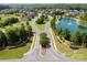 A photograph of an upscale community featuring a pond with a fountain and well-maintained landscaping at 2812 Julian Glen Cir, Waxhaw, NC 28173