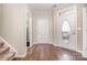 Welcoming foyer featuring hardwood floors, a staircase, and ample natural light at 284 Garnet Ct, Fort Mill, SC 29708