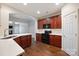 Renovated kitchen with quartz counters, dark cabinets, and breakfast bar at 284 Garnet Ct, Fort Mill, SC 29708