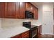 Updated kitchen featuring stainless steel appliances and dark wood cabinets at 284 Garnet Ct, Fort Mill, SC 29708