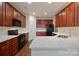 Updated kitchen features quartz countertops, dark cabinetry, and black appliances at 284 Garnet Ct, Fort Mill, SC 29708