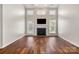 Inviting living room with fireplace, hardwood floors, and a patio door at 284 Garnet Ct, Fort Mill, SC 29708