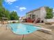 Expansive backyard with a refreshing pool, diving board, and an entertainment area with built-in grill at 3038 Sterling Ct, Fort Mill, SC 29707