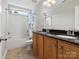 Bathroom featuring double sinks, granite countertop, tile flooring, and a shower-tub combo at 3038 Sterling Ct, Fort Mill, SC 29707